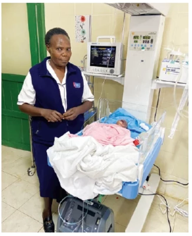Spoluzakladatelka
zdravotního
střediska,
zdravotní sestra
Elisabeth
při péči o nedonošeného
novorozence